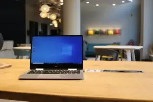 macbook pro on brown wooden table