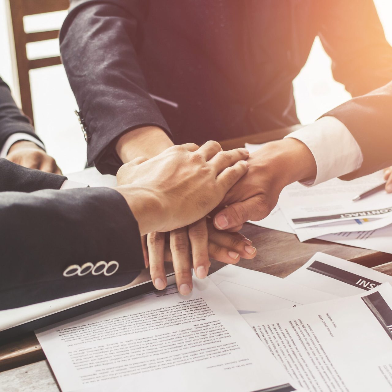 About us at TAXEDO LLP, hands crossed for a strong bond between our firm and clients.